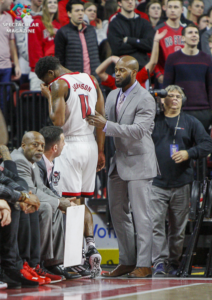 N.C. State's Markell Johnson grimaces from back spasams during the first half against Notre Dame on Wednesday, Jan. 8, at PNC Arena in Raleigh, N.C. NCST defeated ND 73-68.