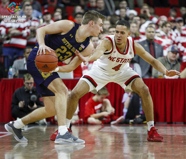 N.C. State's Jericole Hellems (4) guards Notre Dame's Dane Goodwin (23) during the second half on Wednesday, Jan. 8, at PNC Arena in Raleigh, N.C. NCST defeated ND 73-68.
