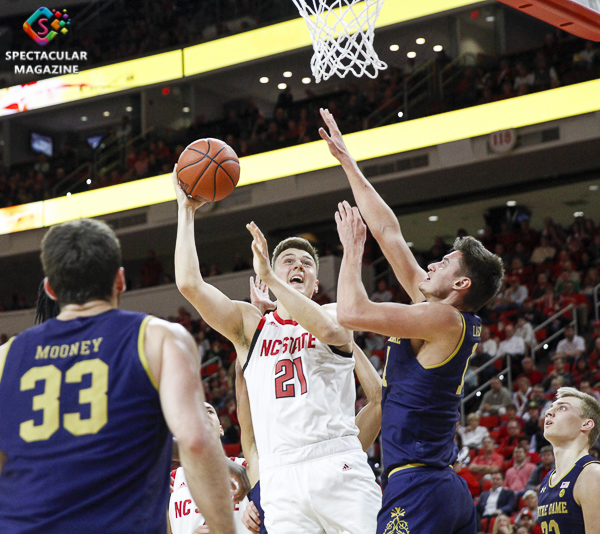 N.C. State's Danny Dixon attemps a layup against Notre Dame defenders during the second half on Wednesday, Jan. 8, at PNC Arena in Raleigh, N.C. NCST defeated ND 73-68.