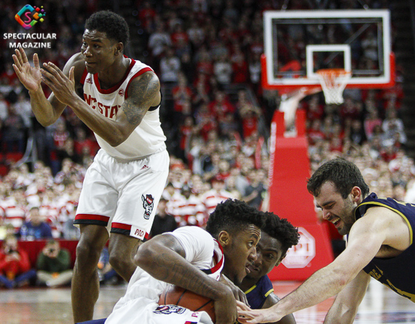 N.C. State's Markell Johnsno tries to call a timeout during a loose ball during the second half against Notre Dame on Wednesday, Jan. 8, at PNC Arena in Raleigh, N.C. NCST defeated ND 73-68.