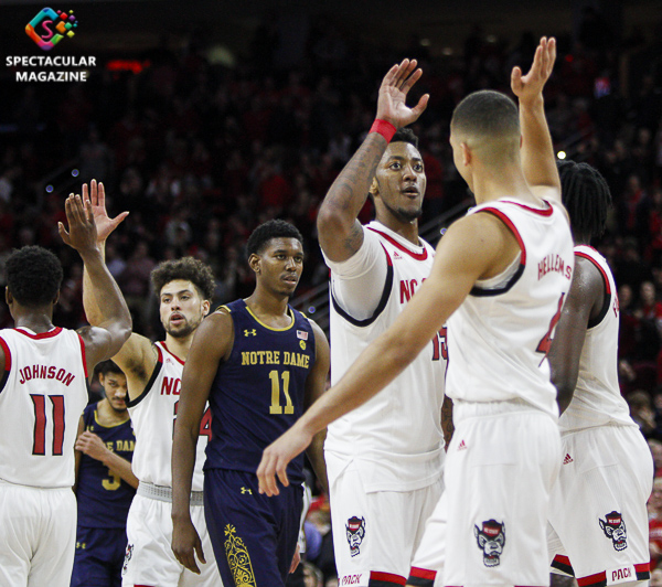 N.C. State players high-five during the second half against Notre Dame on Wednesday, Jan. 8, at PNC Arena in Raleigh, N.C. NCST defeated ND 73-68.