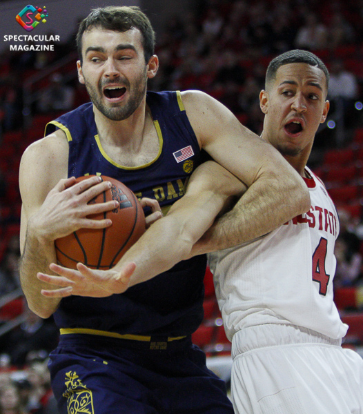 Notre Dame's John Mooney grabs a rebound over N.C. State's Jericole Hellemes during the first half on Wednesday, Jan. 8, at PNC Arena in Raleigh, N.C. NCST defeated ND 73-68.