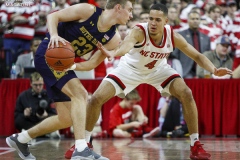 N.C. State's Jericole Hellems (4) guards Notre Dame's Dane Goodwin (23) during the second half on Wednesday, Jan. 8, at PNC Arena in Raleigh, N.C. NCST defeated ND 73-68.