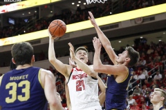 N.C. State's Danny Dixon attemps a layup against Notre Dame defenders during the second half on Wednesday, Jan. 8, at PNC Arena in Raleigh, N.C. NCST defeated ND 73-68.