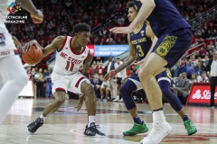 N.C. State's Markell Johnson drives against Notre Dame defenders during the second half on Wednesday, Jan. 8, at PNC Arena in Raleigh, N.C. NCST defeated ND 73-68.