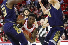 N.C. State's Markell Johnson drives to the basket against Notre Dame defenders during the second half on Wednesday, Jan. 8, at PNC Arena in Raleigh, N.C. NCST defeated ND 73-68.