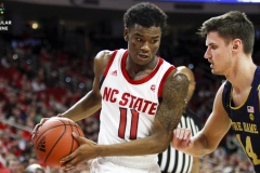 N.C. State's Markell Johnson (11) drives to the basket against Notre Dame's Nate Laszewski (11) during the first half on Wednesday, Jan. 8, at PNC Arena in Raleigh, N.C. NCST defeated ND 73-68.