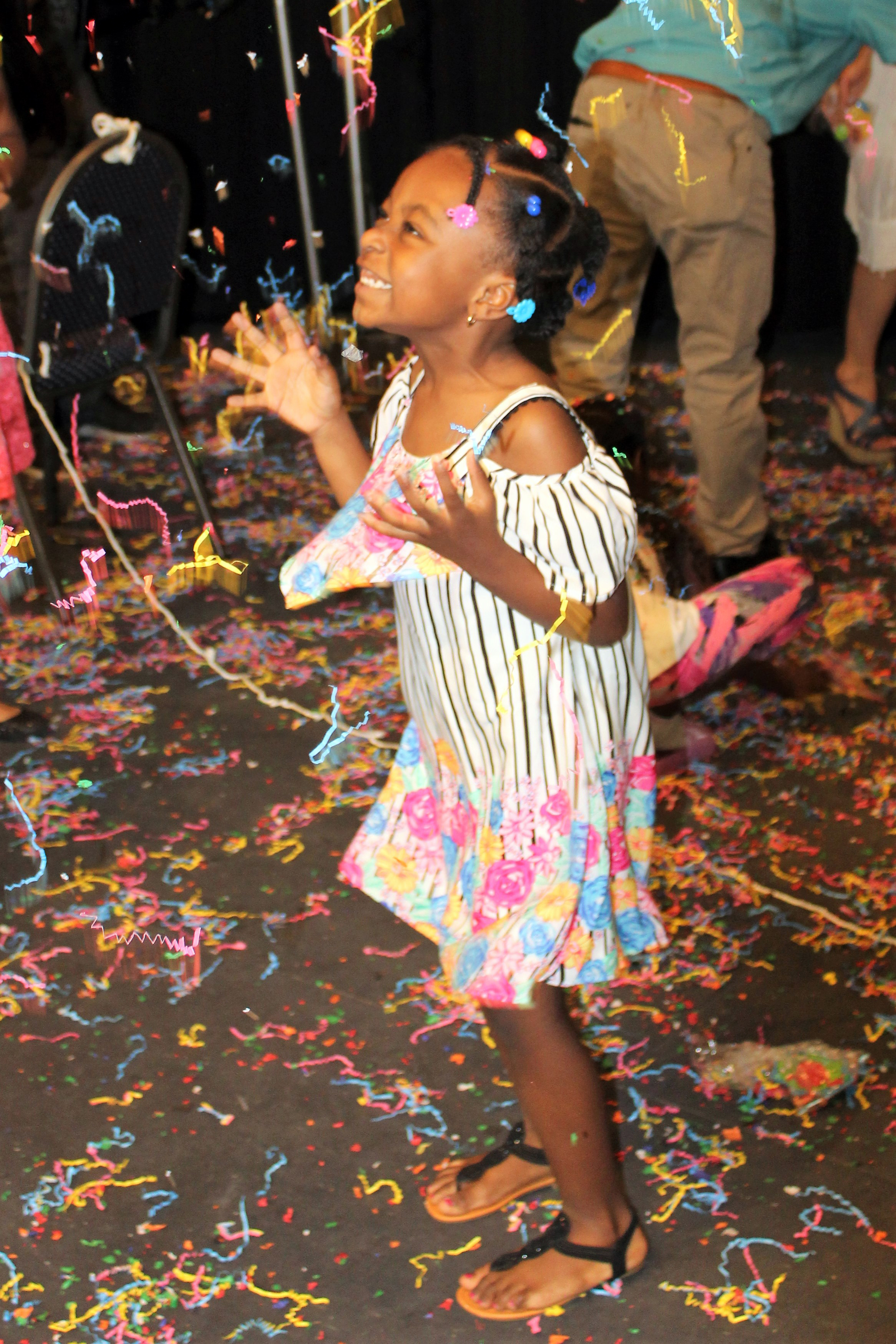 girl-throwing-confetti