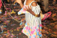 girl-throwing-confetti