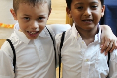 two-boys-with-white-dress-shirts-and-backpacks-on