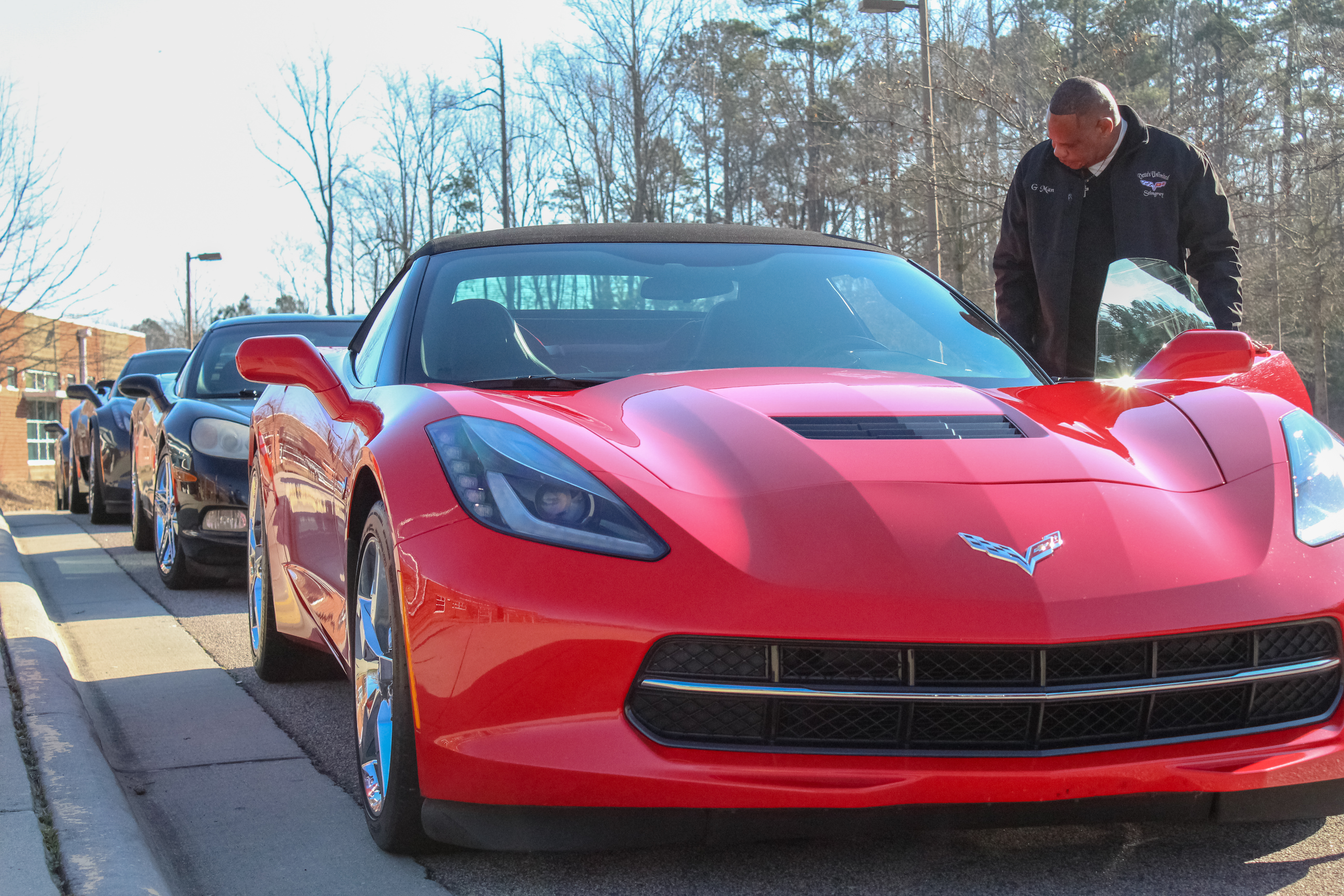 Member of Vettes Unlimited inspect his car before Parade. (Photo: Landon Bost)