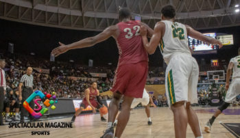 Eagles guard Jordan Perkins with the ball, and Eagles center Raasean Davis posting up.