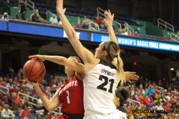 Hawkeyes forward Hannah Stewart's block on Wolfpack guard Aislinn Konig.