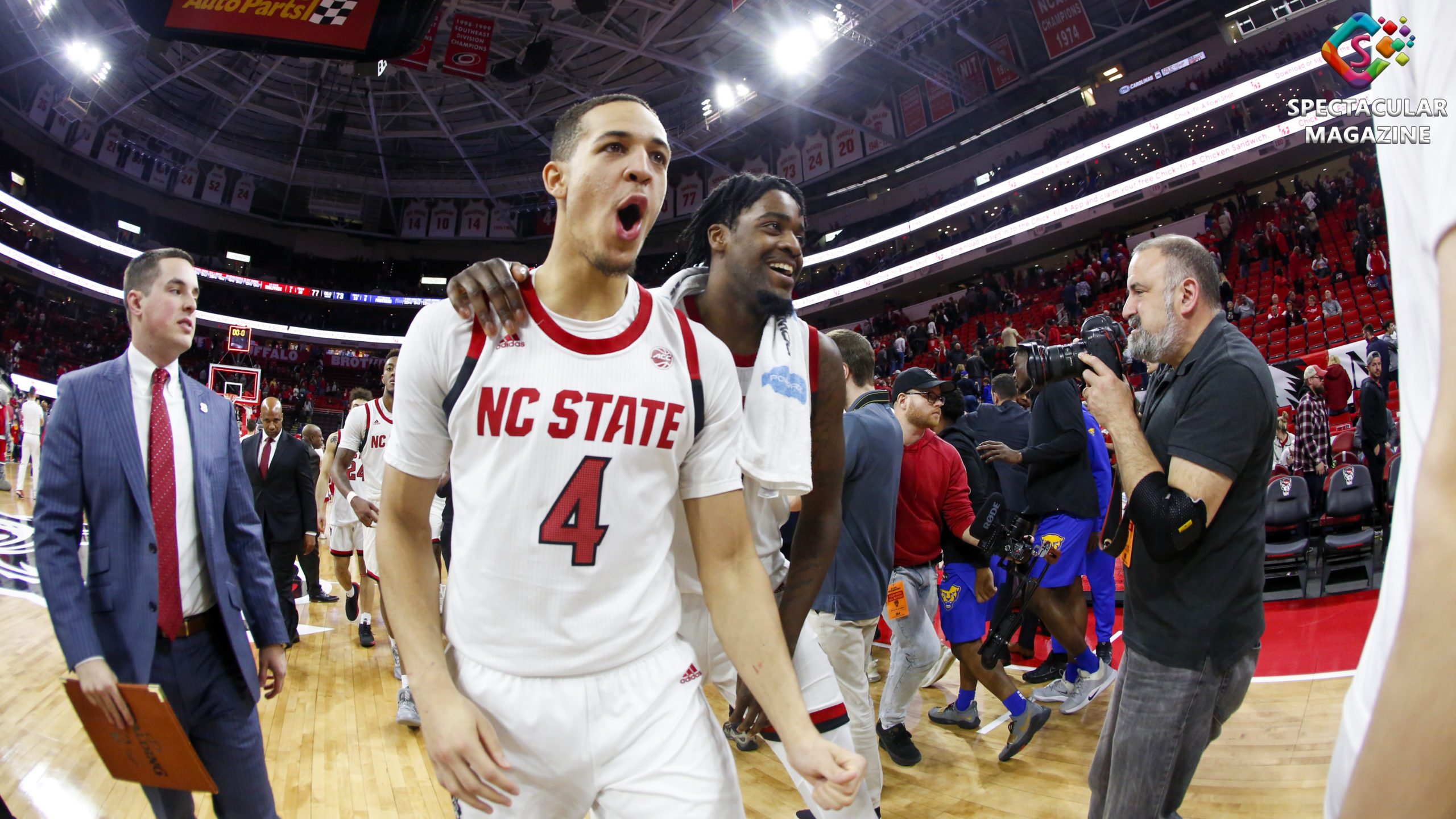 NC State men's basketball guard Jericole Hellems (left) and forward DJ Funderburk (right) celebrate after defeating Pittsburgh 77-73 at PNC Arena in Raleigh, N.C., Saturday, Feb. 29, 2020.