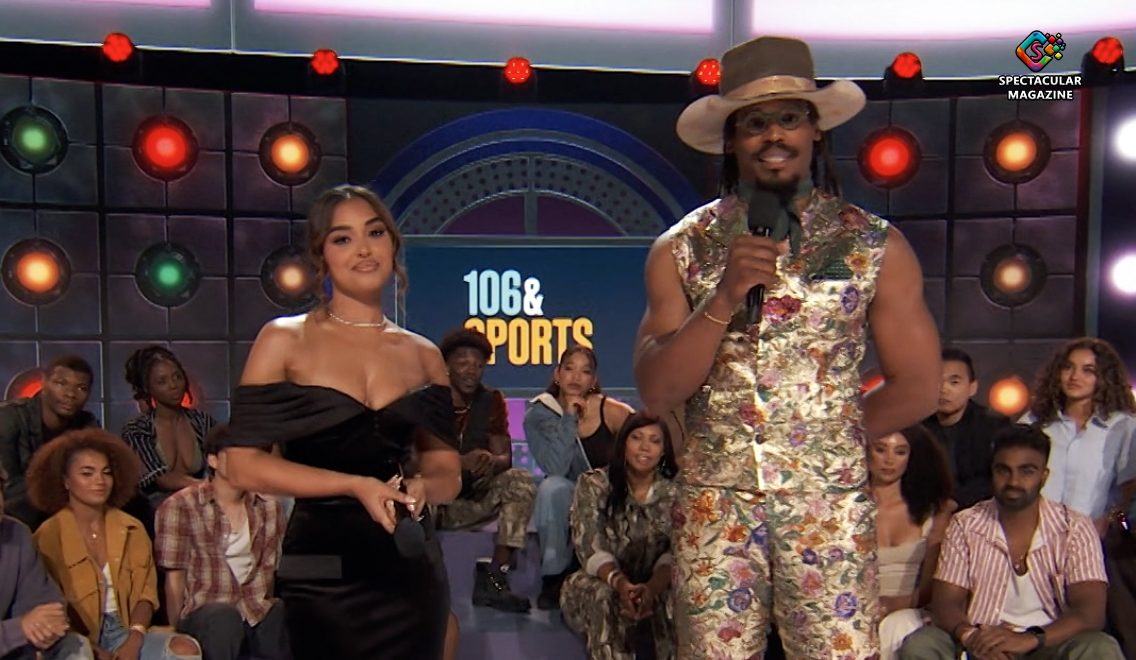 Cam Newton and Ashley Nicole Moss stand on set of BET’s 106 & Sports with a live studio audience behind them.