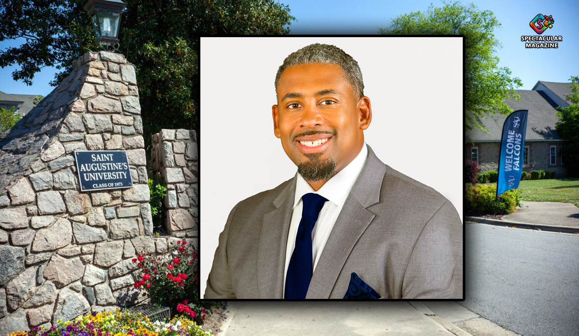 Dr. Marcus Burgess, former Interim President of St. Augustine’s University, wearing a gray suit jacket, white shirt, and navy blue tie, smiling against a plain background.