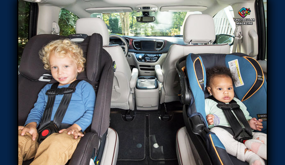 Two young children securely strapped into car seats in the back of a vehicle, demonstrating proper child passenger safety practices.