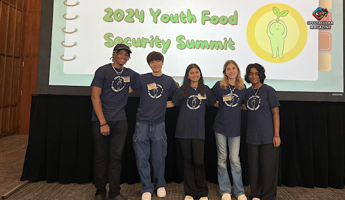 Group of Wake County high school students participating in a youth summit at John Chavis Memorial Park, working together on food security solutions.