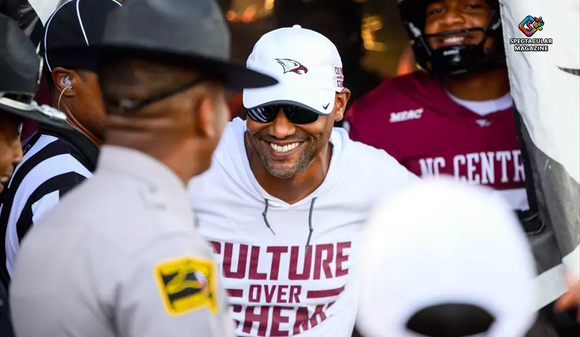 NCCU head coach Trei Oliver smiling on the sideline after running back Chris Mosley leads Eagles’ 62-20 victory over NC A&T.