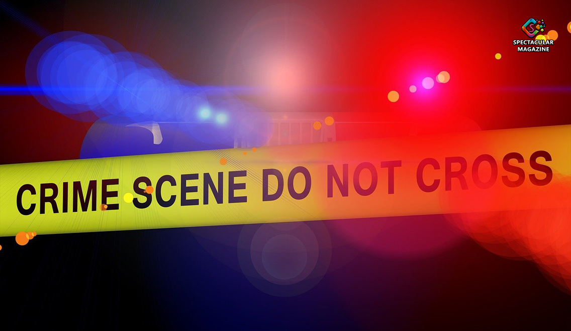 Yellow police crime scene tape blocks access to an active Lathrop Street investigation area at night in Durham, North Carolina.