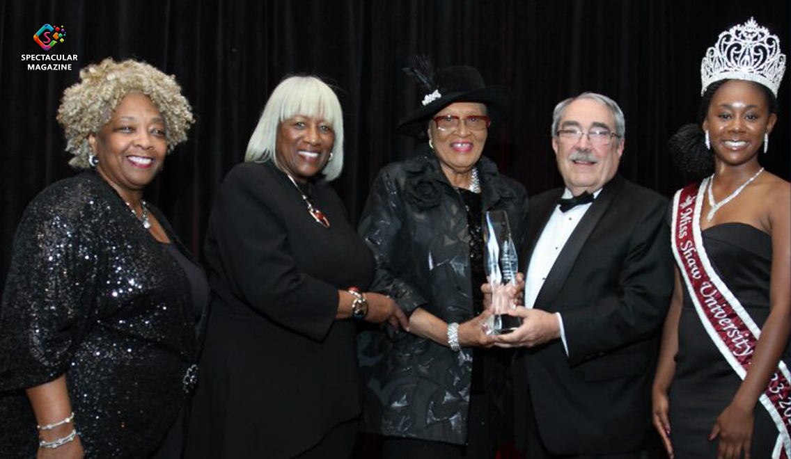 Dr. Paulette Dillard, U.S. Rep. Alma Adams, former U.S. Rep. G.K. Butterfield, Mrs. Marilyn Baldwin Richards, and Miss Shaw University Janell Odom pose together on stage during the 2023 HBCU Triumph Gala, where Rep. Adams received the Distinguished Alumni Award.