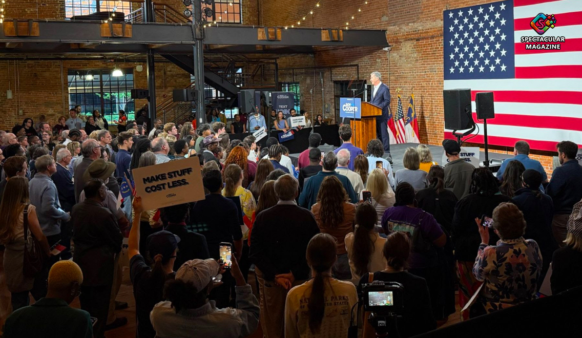 Crowd gathered in Durham as Roy Cooper speaks at rally podium during Make Stuff Cost Less tour