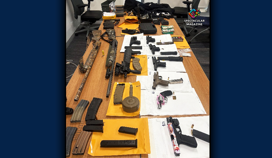 Ten firearms, including rifles and guns, displayed alongside ammunition, magazines and other evidence seized by Durham police during an October 14, 2026, investigation.